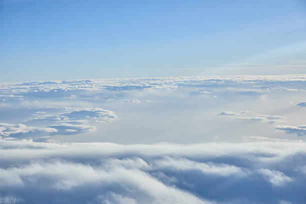 Bright blue sky stretches above a sea of soft clouds, creating a calm, expansive mood. Ideal for travel, nature, aviation, and serene lifestyle themes.