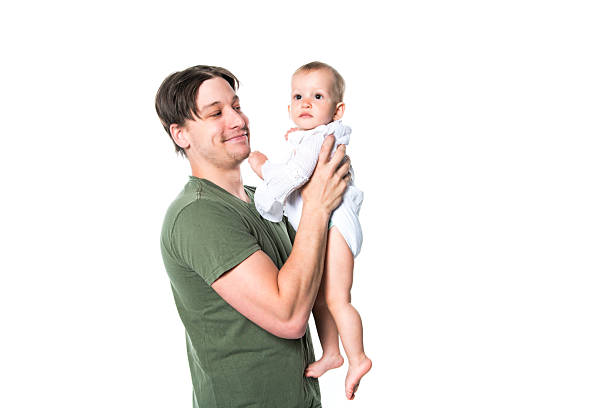 istock Father holding small cute baby on studio white background 2248399502