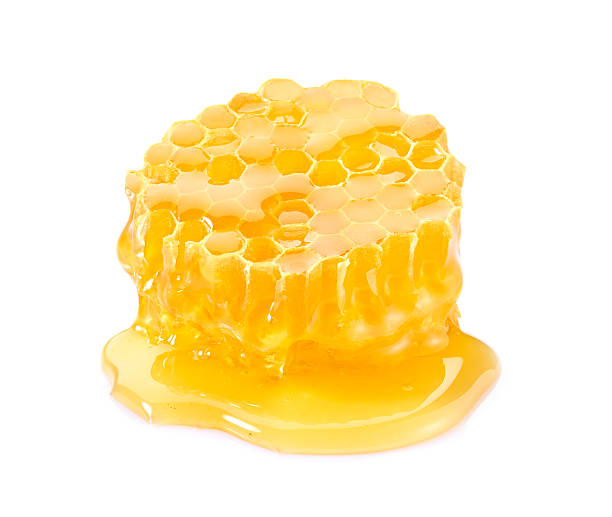 istock Honeycomb with honey on white background 2248400701