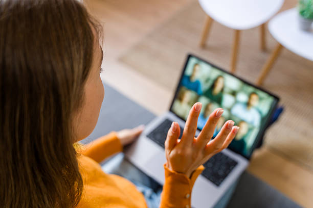 istock Woman making visual communication during online meeting at home 2248400793