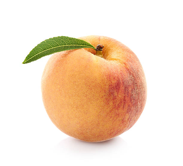 istock Peach with leaves in closeup on white background 2248401249