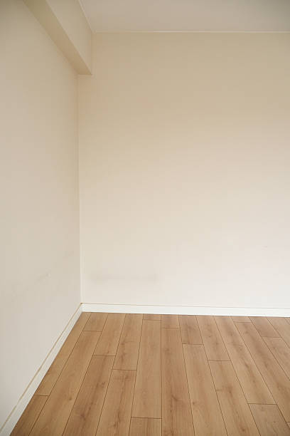 istock Empty room with light wood flooring and neutral walls 2248401412