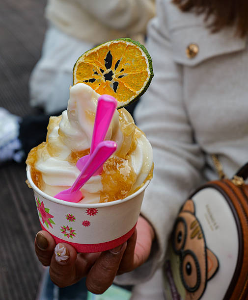 istock Soft-Serve Ice Cream with Honey Syrup and Citrus Slice 2248402212