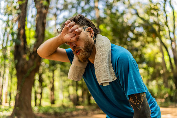 istock Tired mid adult man exercising on a public park 2248402564