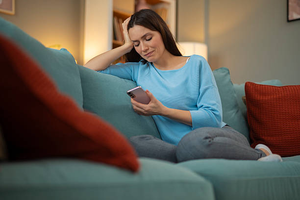 istock Woman feeling bored and unhappy while using smartphone 2248404059