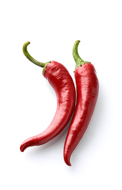istock Red chili peppers on white background 2248404074
