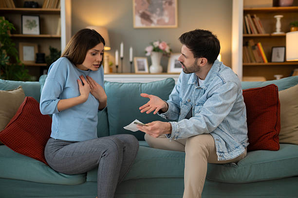 istock Couple arguing about finance struggling with money problems 2248404769
