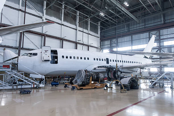 istock White passenger airplane under maintenance has opened weather radar and engine removed located nearby in the aircraft hangar 2248406673