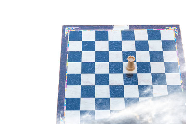 White rook piece isolated on a chess board with an open area for text