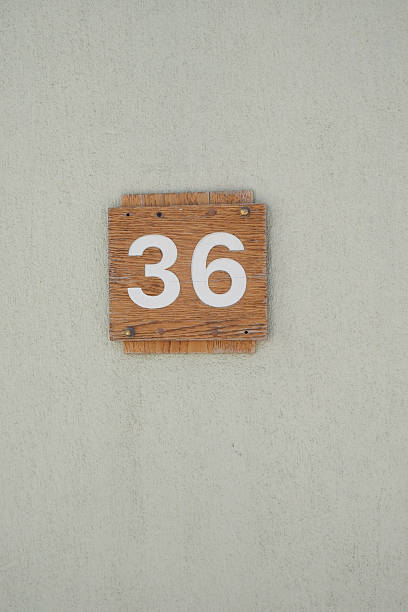 istock House number 36 displayed on a wooden sign 2248407138