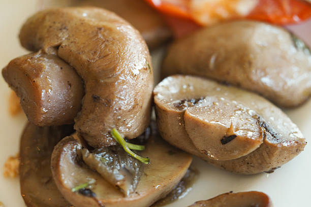 istock Freshly cooked mushrooms served on a white plate 2248407380