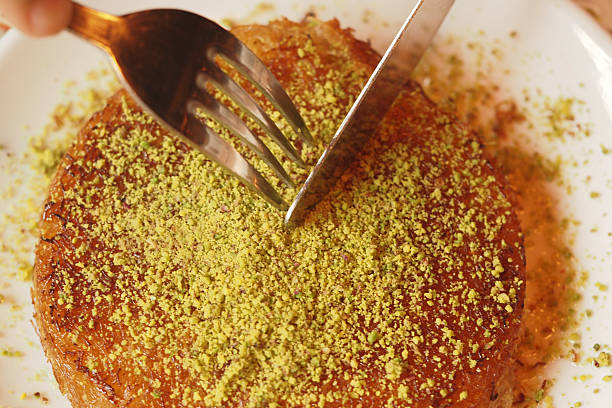 istock Delicious kunafa with pistachio topping served warm 2248407517