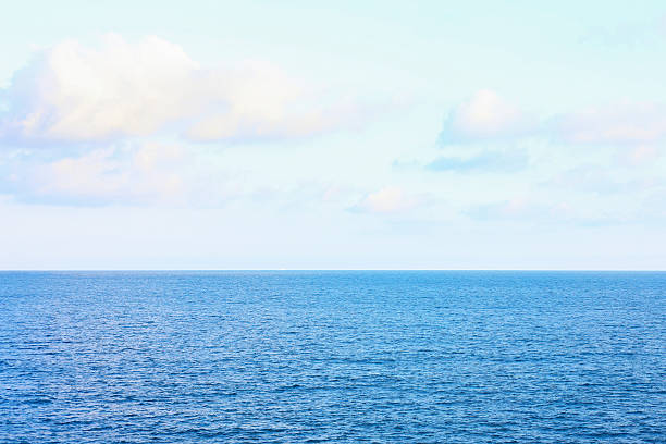 istock Beautiful view of wavy sea under blue cloudy sky 2248407719