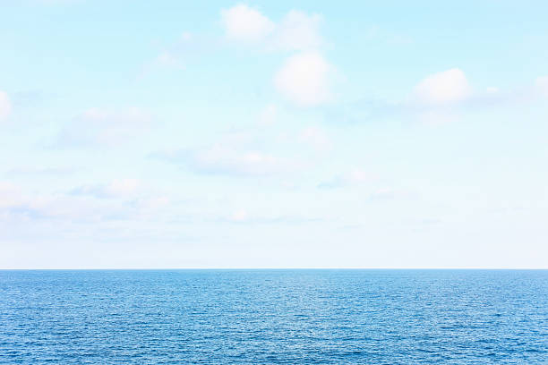 istock Beautiful view of wavy sea under blue cloudy sky 2248407722