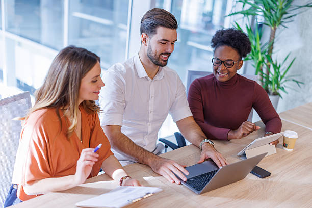 istock Diverse business team collaborating on laptop computer in office 2248407899