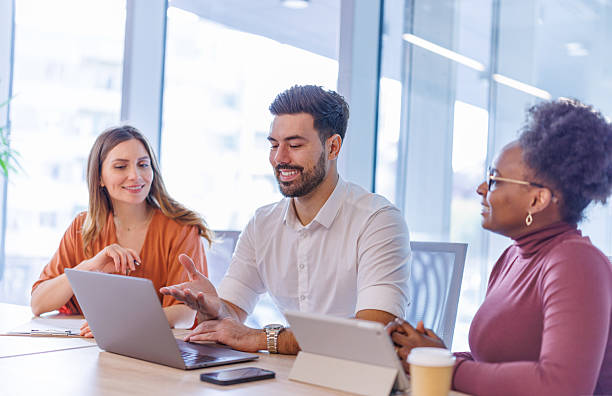 istock Business team collaborating on laptop during office meeting 2248407932