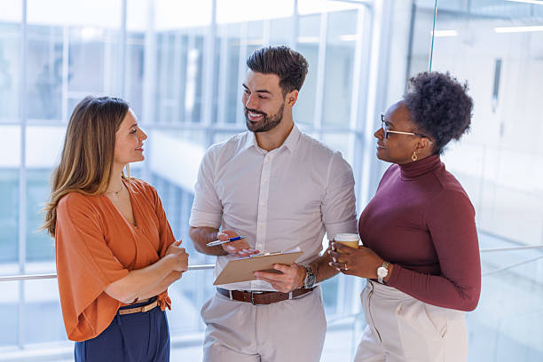 istock Diverse business people talking discussing work at office 2248407941