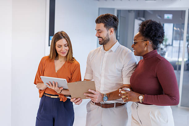 istock Diverse business colleagues discussing project during office break 2248408025