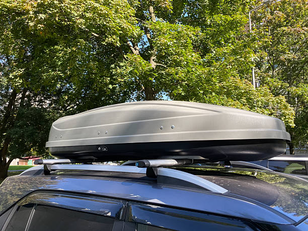 istock Hard-shell roof rack or Plastic auto roof box. Car luggage. Convenient format for carrying luggage 2248412182