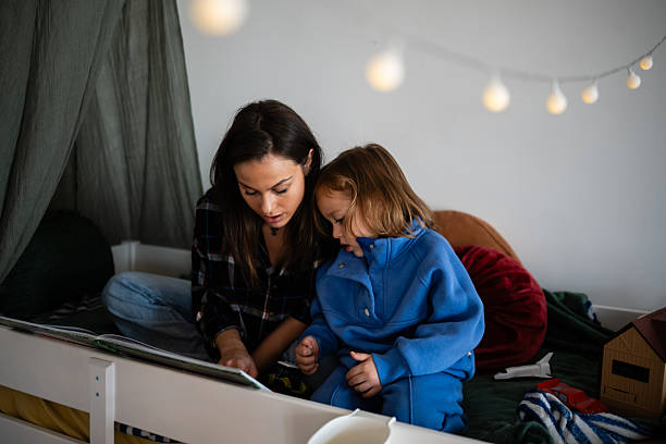 istock Mother and child bonding reading bedtime story 2248412683