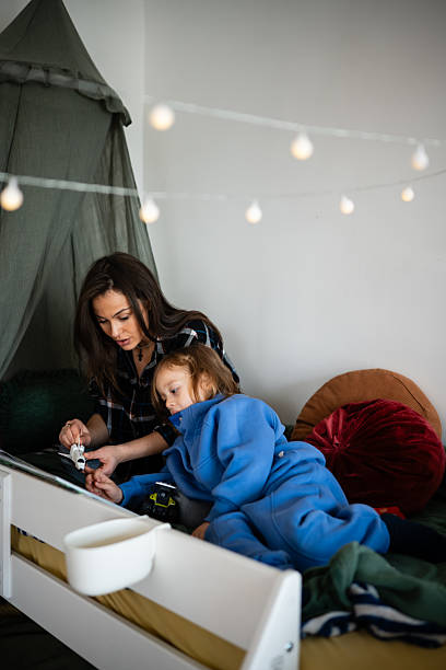 Mother and child playing with toy airplane