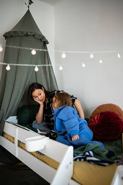 istock Mother and son bonding during bedtime story 2248413183