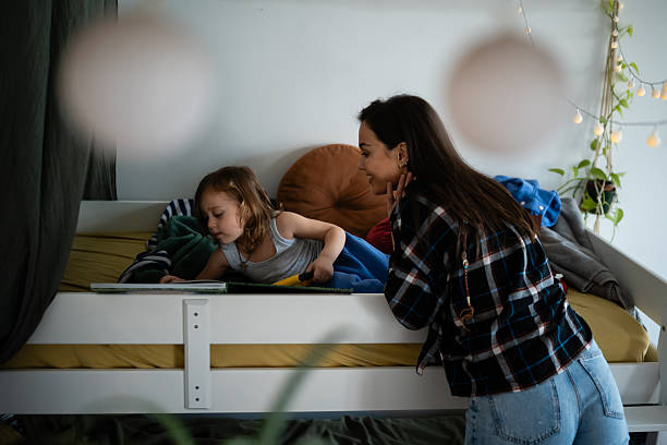 istock Mother and son reading bedtime story together 2248413648