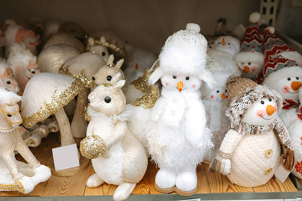 istock Festive winter decorations: plush snowmen and glittering animals 2248413670