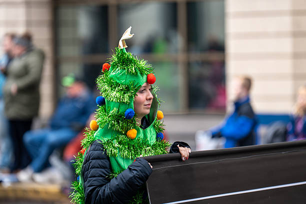 Harrisburg, PA, USA  November 22, 2025: A person dressed as a Christmas tree appears in the Holiday Parade.