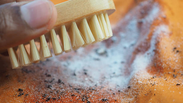 istock Cleaning a cloth with a brush and baking soda 2248417112
