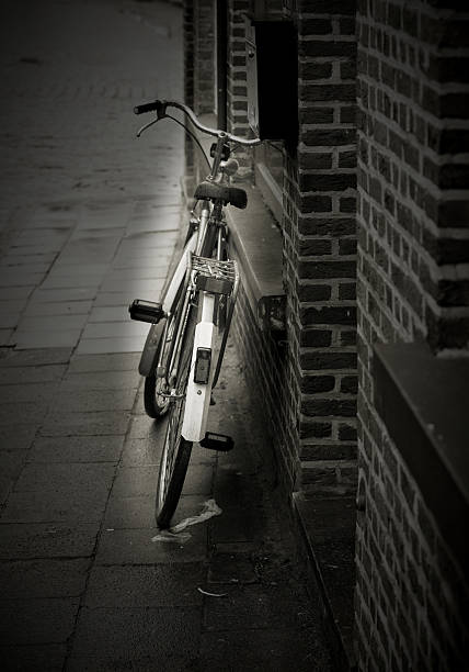 istock Bicycle parked against a house wall 2248418410