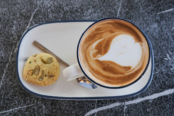 istock Cozy coffee and cookie on a marble table 2248418586