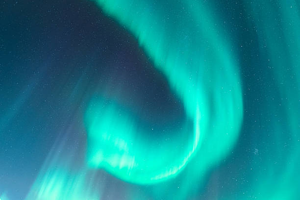 istock Aurora borealis creating vibrant green light across the night sky in Sweden 2248418896