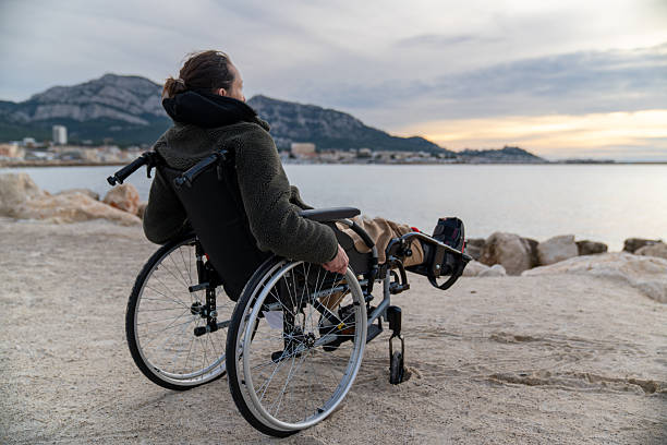 istock Young disabled woman in a wheelchair 2248419075