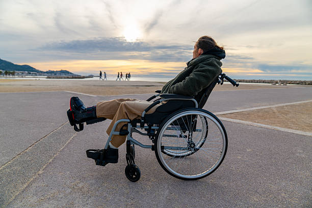 istock Young disabled woman in a wheelchair 2248419082
