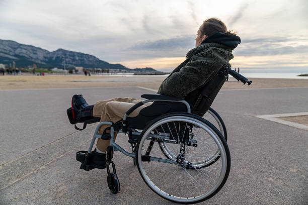 istock Young disabled woman in a wheelchair 2248419085
