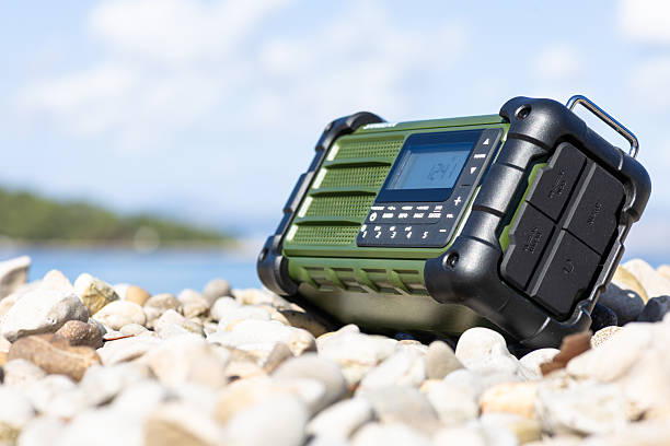 istock Rugged Handheld Radio With Digital Display On Pebble Ground For Fieldwork 2248419343