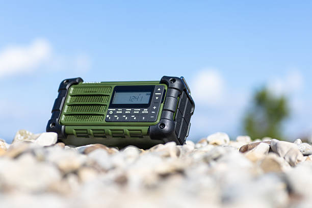 istock Rugged Handheld Radio With Digital Display On Pebble Ground For Fieldwork 2248419456
