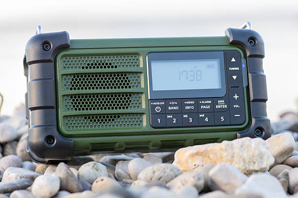 istock Rugged Handheld Radio With Digital Display On Pebble Ground For Fieldwork 2248419457