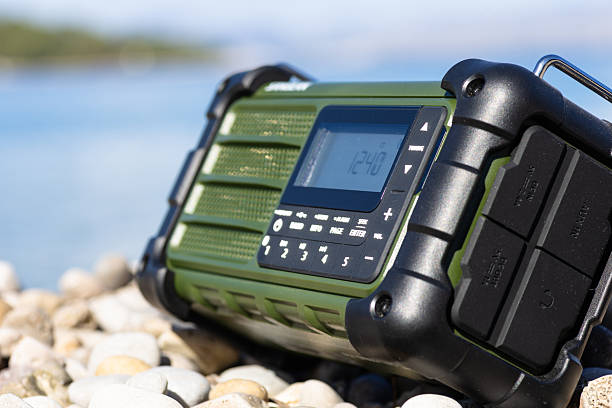 istock Rugged Handheld Radio With Digital Display On Pebble Ground For Fieldwork 2248419459