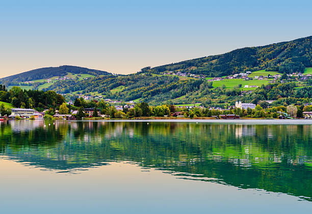 Lake Millstätter See in Carinthia. Panorama of the famous lake in the Drautal in Austria. Scenic landscape in the southern part of the country during early morning.