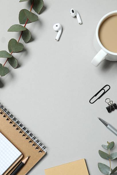 istock Stationery, notepad with a pencil, coffee cup and green plant. Stylish workplace 2248421896