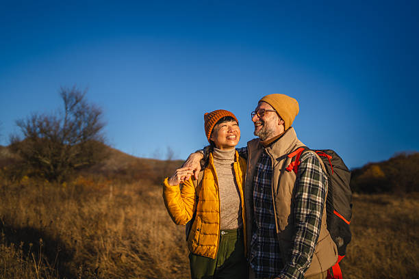 istock Senior couple enjoying autumn hike outdoors together smiling 2248422838