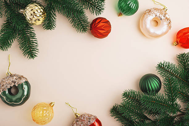 istock Christmas Donuts Ornaments and Pine Branches on Light Beige Background 2248423550