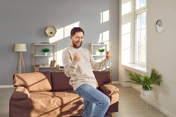 istock Happy, excited young man saying Yeah and doing a yes fist gesture with both hands 2248424484
