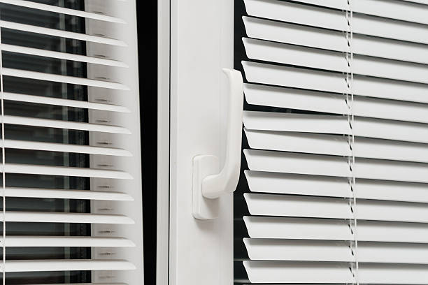 istock white blinds on plastic window in home or office 2248426003