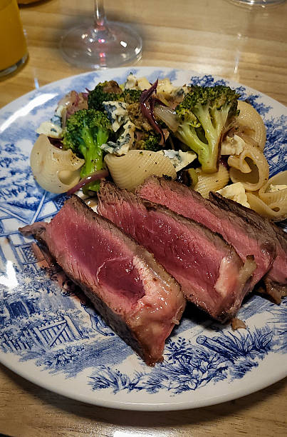 istock Medium-Rare Steak Served with Pasta, Broccoli and Blue Cheese 2248428947