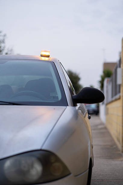 istock Car showing emergency warning beacon on roof, emergency led light 2248430732