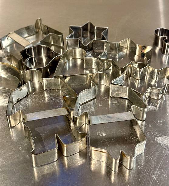 istock Assorted Metal Cookie Cutters on Stainless Steel Surface 2248435994