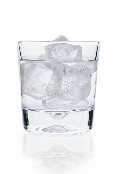 istock Transparent Glass with Icy Water on Clean White Background 2248436064